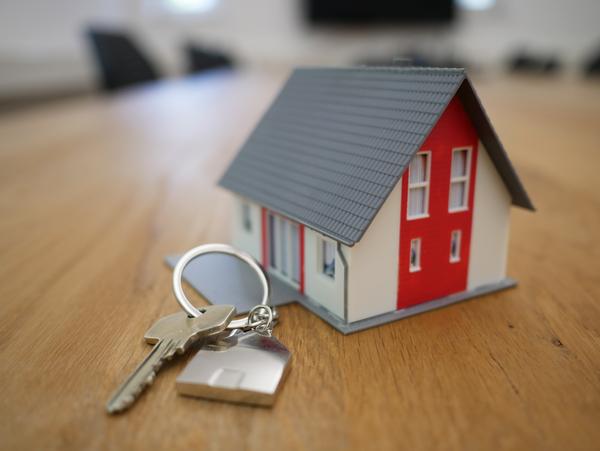 small image of house with key next to it