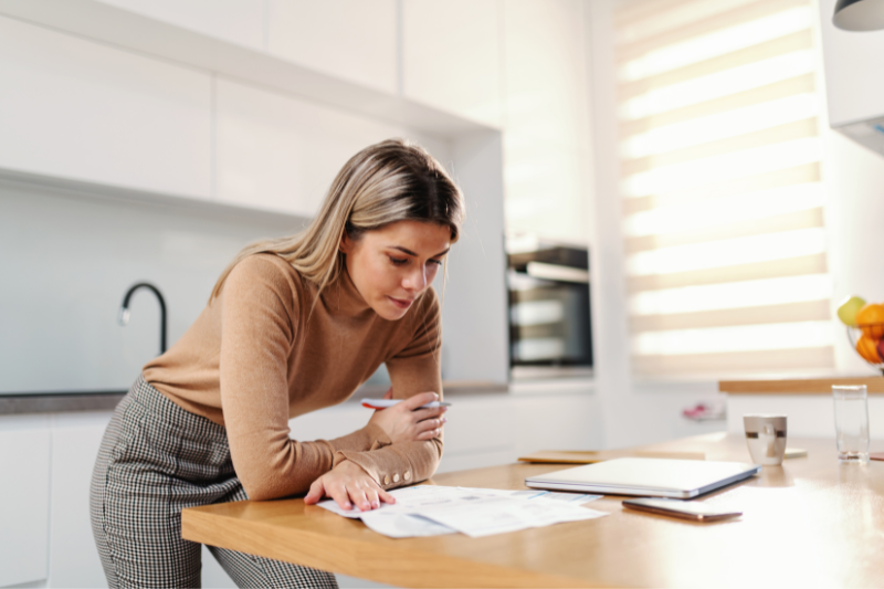 Woman-analyzing-loan-documents